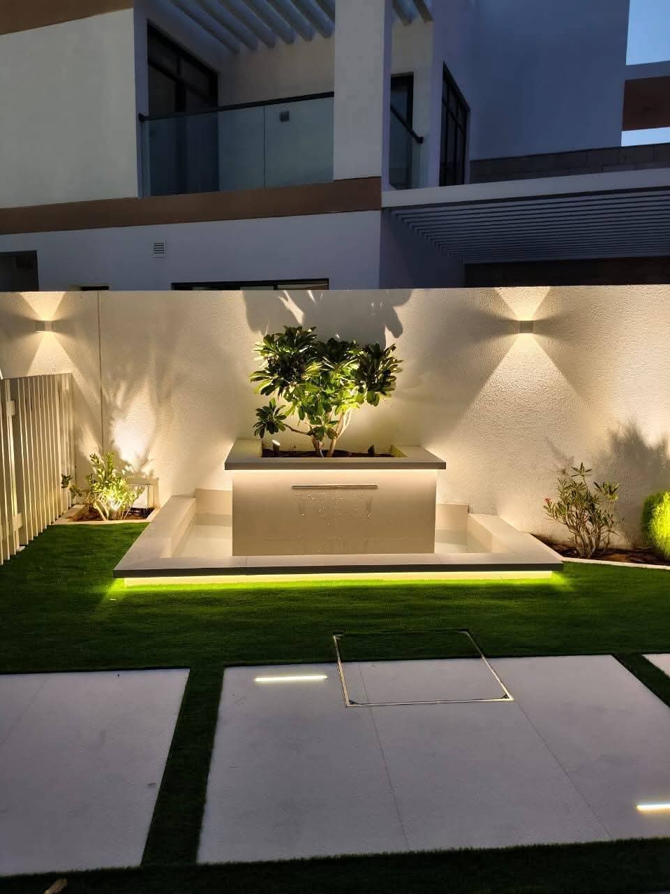 Garden water feature with landscape lighting